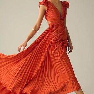 Mac Duggal pleated flutter sleeve deep V lace-up gown